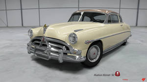 奶油色1952年Hudson Hornet經典汽車在乾淨的車庫中，帶有鍍鉻裝飾。