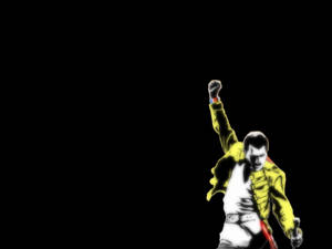 Freddie Mercury 身穿黃色外套在黑色背景上舉起拳頭