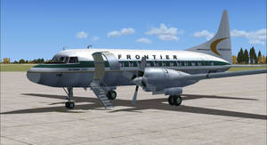 復古 Frontier Airlines 螺旋槳飛機在停機坪上，登機梯展開。