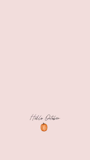 蜜桃色背景上帶有 Hello October 文字和一個小南瓜。