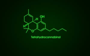 深色紋理背景上的四氫大麻酚霓虹綠色化學式