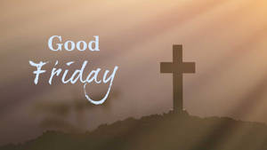 山丘上的十字架剪影，以及金色夕陽中閃耀的「Good Friday」文字。
