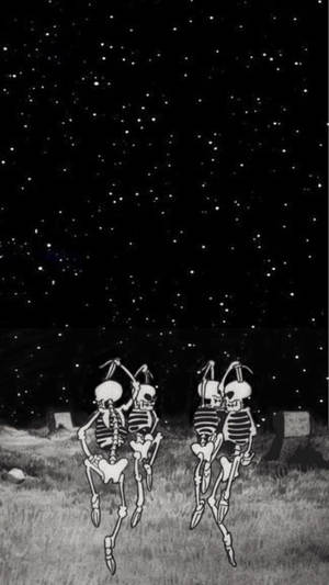 兩個骷髏在星空下的墓地上跳舞。