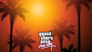 Grand Theft Auto Vice City 標誌在日落和棕櫚樹剪影前。