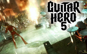 Guitar Hero 5遊戲封面，顯示一位結他手在舞台上與人群一起表演。 — 音樂美學 壁紙