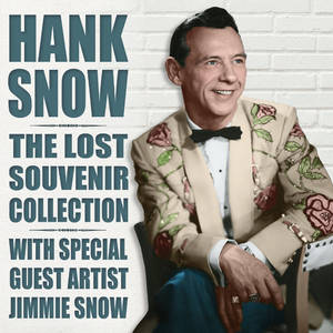 Hank Snow 穿著玫瑰刺繡西裝，在復古文字旁微笑。 — 音樂 GIF 壁紙