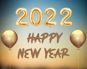 金色氣球和文字慶祝2022年。