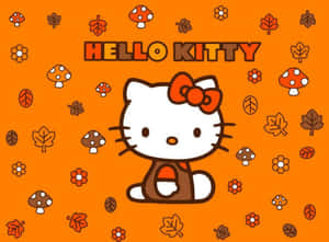 Hello Kitty 喺橙色背景上帶住蘑菇同樹葉嘅秋天主題圖案。