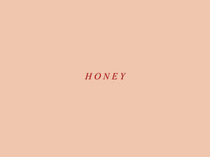 「honey」呢個詞用紅色字體喺蜜桃色背景上。 — Cia標誌 壁紙