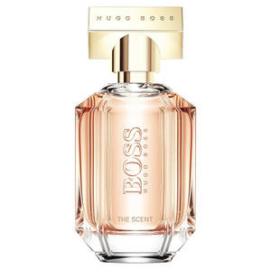 Hugo Boss香水瓶，帶有金色蓋和粉紅色液體。