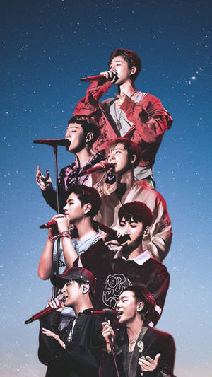 七位K-pop歌手在星空下舞台上表演。
