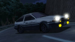白色和黑色的AE86跑車在夜晚的彎曲道路上疾馳，車頭燈發光。