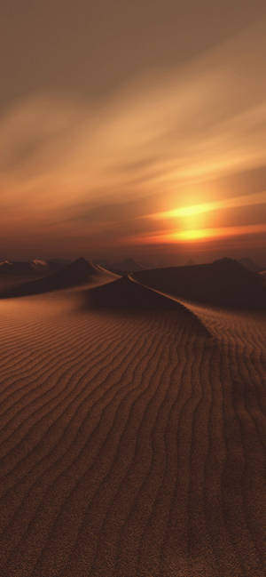 沙漠景觀中起伏沙丘上的日落 — iPhone 16 Plus 壁紙