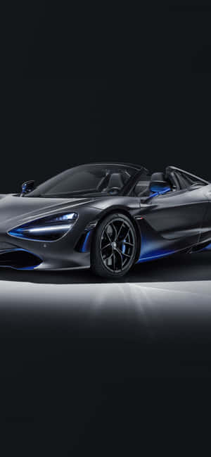 時尚的灰色McLaren 720S Spider，在黑暗的攝影棚中帶有藍色燈光。 — 藍色 壁紙