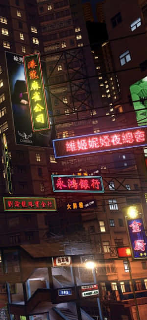 夜間城市景觀，高樓上閃爍著霓虹燈牌。 — iPhone 16 Plus 壁紙