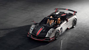 時尚的銀色帕加尼 Huayra Roadster，帶有紅色點綴和賽車號碼20，停在深色混凝土上。 — 天空景觀 壁紙