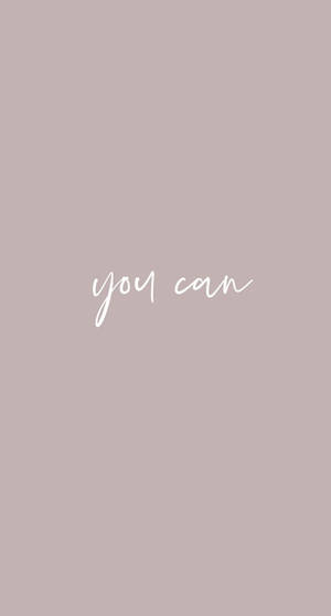 紫灰色背景上以白色草書呈現的勵志語句「you can」