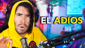 身穿黃色連帽衫的男子在遊戲直播中對'EL ADIOS'文字做出反應。 — 黃色 壁紙