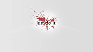 簡約壁紙，帶有紅色油漆飛濺和粗體文字 just do it。