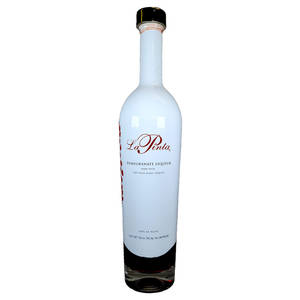 La Pinta 石榴利口酒的白色瓶子，帶有紅色文字和黑色蓋子。