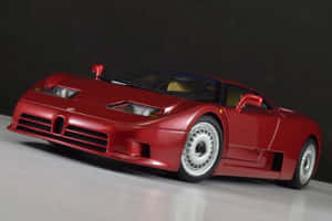 紅色Bugatti EB110模型車在白色表面上，背景為深色。 — Surface Pro 壁紙