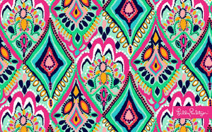 大膽多彩的幾何圖案，帶有重複的菱形和圓點。