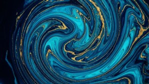 藍色和金色顏料的抽象漩渦，具有流動感和大理石紋理