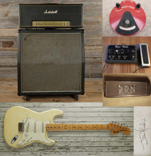 復古Fender Stratocaster結他與Marshall擴音器及效果器，置於木質表面。