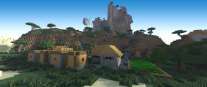 Minecraft村莊，有木屋和石頭地基，被綠化和山脈環繞。