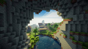 從Minecraft洞穴內部看到的景色，顯示外面的河流、樹木和村莊。 — 綠色動態圖 壁紙