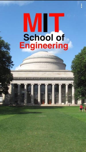 MIT 工程學院建築，在藍天下有綠色草坪和樹木。