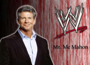 Mr McMahon 身穿西裝，在紅色背景上帶有WWE標誌。 — WWE GIF 壁紙