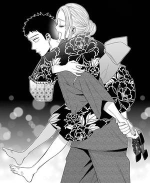 一位穿著花卉和服的女性在柔和的散景背景中抱著一個男人。