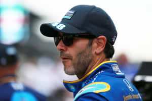 NASCAR車手Jimmie Johnson身穿藍色賽車制服和帽子 — 賽車 壁紙