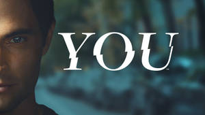 男人特寫肖像，眼神強烈，旁邊是白色文字「YOU」。