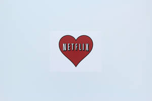 紅色心形Netflix標誌貼紙在淺藍色背景上。 — Netflix GIF 壁紙