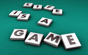 白色3D積木在青綠色背景上拼出「Life is a game」。