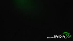 NVIDIA標誌在深色紋理背景上發出綠色光芒。