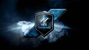 OCZ Gaming標誌盾牌在黑暗的宇宙場景中發出藍光，帶有破碎玻璃效果。