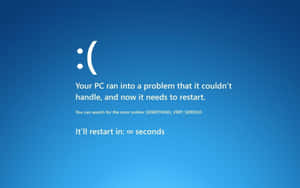 Windows PC錯誤畫面，顯示悲傷表情和重新啟動訊息。