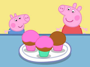 Peppa Pig 同 George 望住碟上嘅紙杯蛋糕。 — 可愛卡通 壁紙