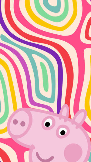 Peppa Pig 微笑，背景為色彩繽紛的旋轉彩虹 — 可愛卡通 壁紙