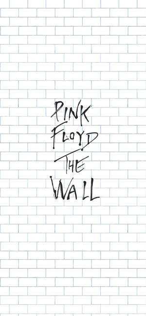 Pink Floyd The Wall 專輯標題以黑色手寫字體顯示在白色磚牆上。