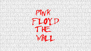 Pink Floyd The Wall 專輯封面，歌詞牆上有紅色文字。