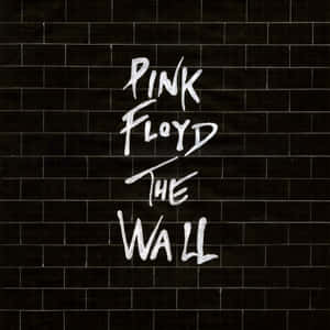 Pink Floyd The Wall 專輯封面，黑色瓷磚牆上有白色手寫文字。