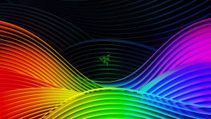 深色背景上帶有發光Razer標誌的動態彩虹波浪 — 彩虹美學 壁紙