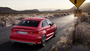 紅色Audi S3房車喺沙漠公路上，有個25 M.P.H.速度限制路牌。 — 奧迪 GIF 壁紙
