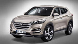 米色Hyundai Tucson SUV在工作室燈光下，配有漸變灰色背景。 — 現代汽車 壁紙