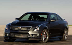 黑色Cadillac CTS-V運動雙門跑車，配備紅色制動卡鉗，停在瀝青路面上。 — Steam Deck 壁紙