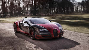 日落時分，森林中的碎石上停著紅色和黑色的Bugatti Veyron。 — 布加迪 壁紙